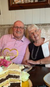 Pamela and her husband smiling